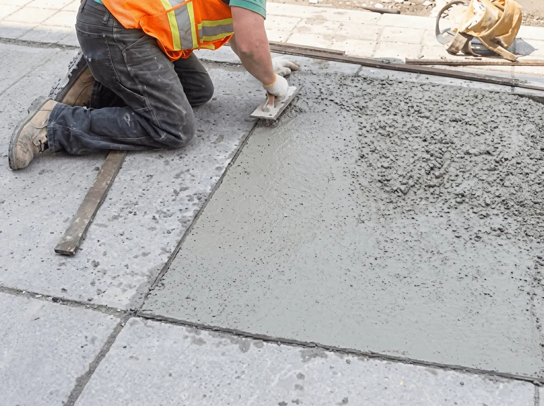 Professional repairing a concrete floor in Lincoln, NE